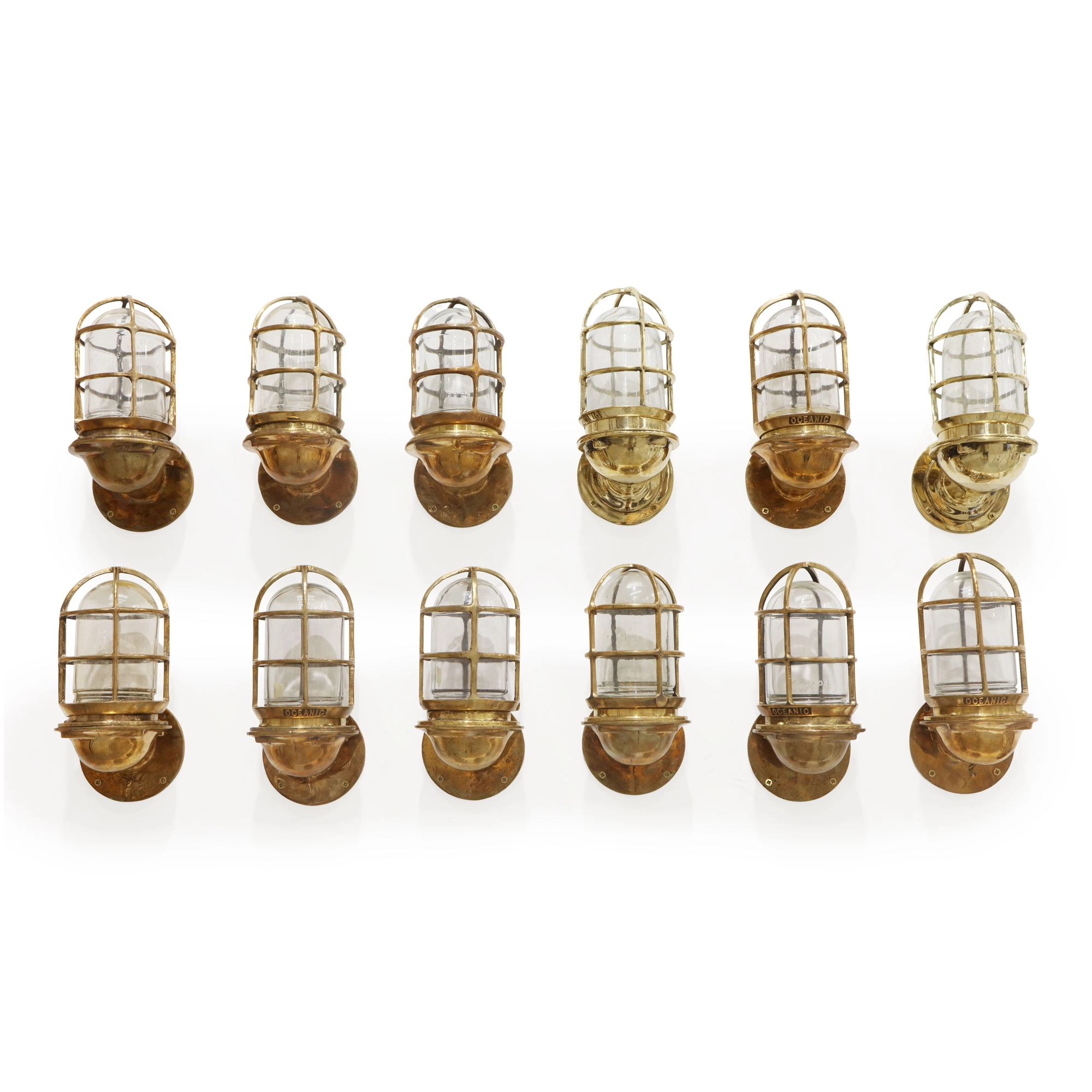 SET OF TWELVE OCEANIC BRASS BULKHEAD WALL LIGHTS
